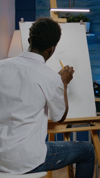 African american artist working on white canvas with drawing - Φωτογραφία, εικόνα