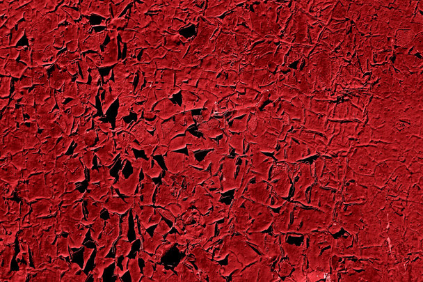Rood gebarsten verf achtergrond. Geschilderde Red Peeling Metal textuur achtergrond. Gebarsten gevel. Rode abstracte achtergrond. Abstract grunge decoratieve donkere muur achtergrond. Schilferverf - Foto, afbeelding