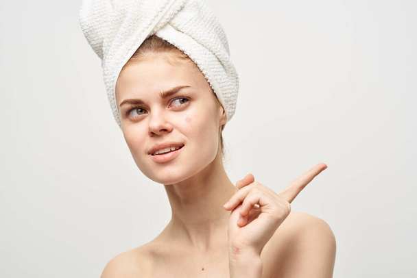 pretty woman with a towel on my head dermatology isolated background - Photo, Image
