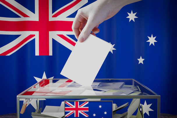 drapeau de l'Australie, dépôt à la main d'une carte de vote dans une boîte - vote, concept électoral - illustration 3D - Photo, image