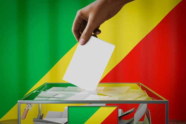 Drapeau du Congo, dépôt manuel d'une carte de vote dans une boîte - vote, concept électoral - illustration 3D - Photo, image