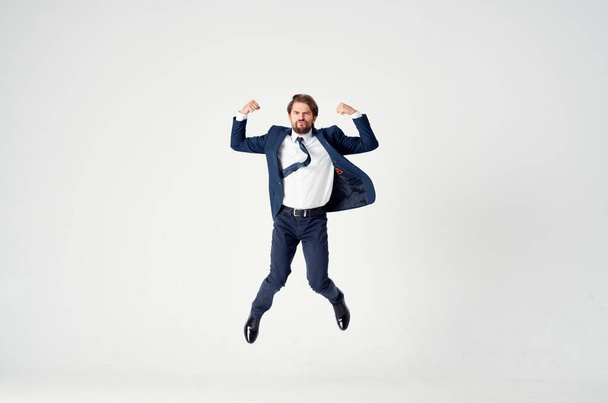 business man in a suit emotions jumping full height Victory - Foto, imagen