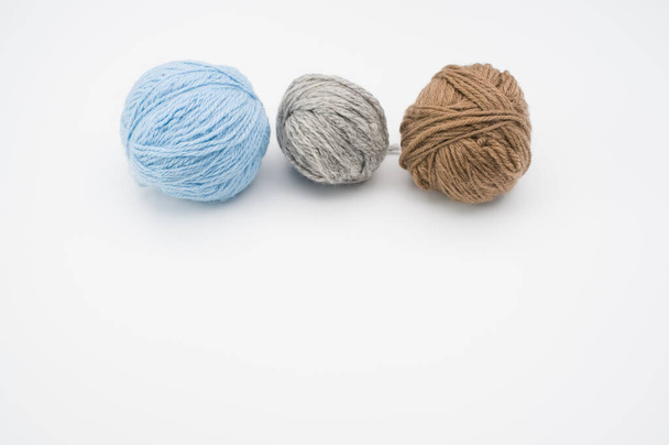 A closeup shot of colorful yarns on a white background - Foto, immagini