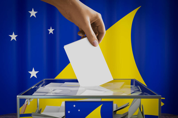 Tokelau vlag, hand laten vallen stemkaart in een doos - stemming, verkiezingsconcept - 3D illustratie - Foto, afbeelding