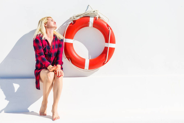 Woman posing with a lifebuoy. lifeguard concept. - Photo, Image