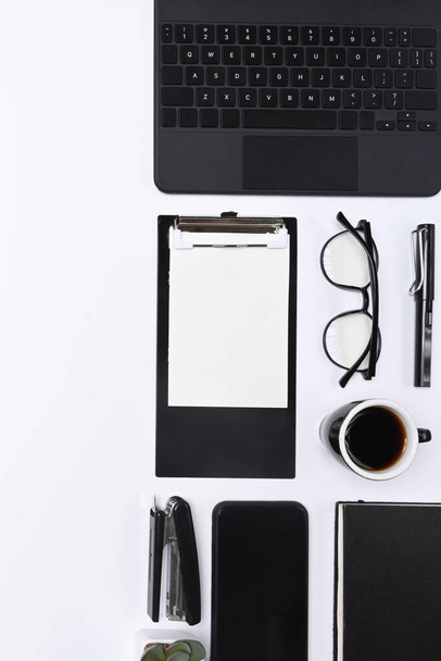 Mobile phone, clipboard, glasses, coffee cup and keyboard on white background. - Φωτογραφία, εικόνα