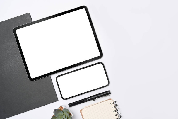 Mock up digital tablet, mobile phone and notebook on white background. - Photo, Image