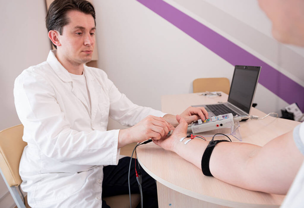 Patient nerves testing using electromyography at medical center - Fotografie, Obrázek