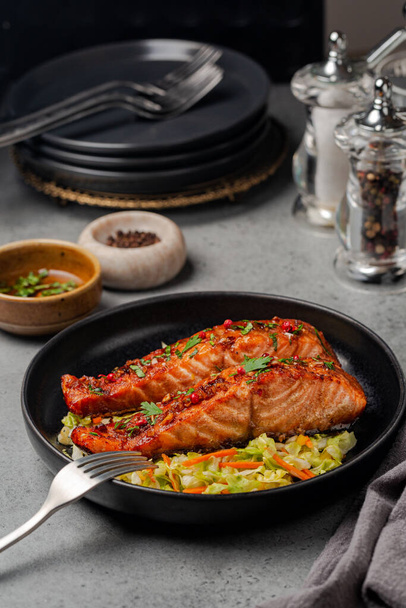 Dinner with honey garlic glazed salmon with cabbage, carrot and bell pepper slaw. Vertical image. - Foto, Imagem