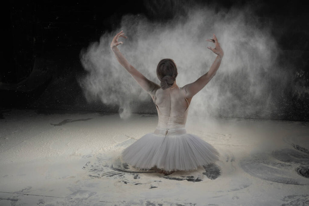 beautiful ballerina dancing in white flour - Фото, изображение