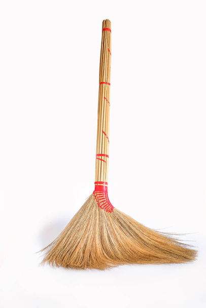 Big yellow broom sweep floor with long wooden handle. - Φωτογραφία, εικόνα