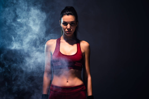 The attractive girl in sportswear standing in the gym - Zdjęcie, obraz