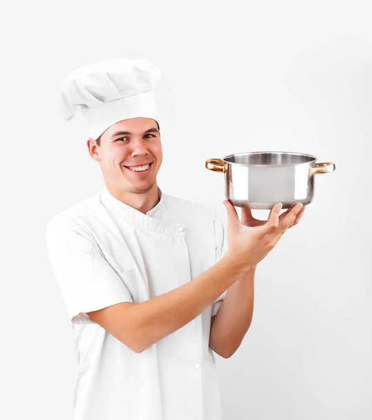 happy caucasian chef holding empty saucepan isolated on white background. smiley face. - Photo, Image