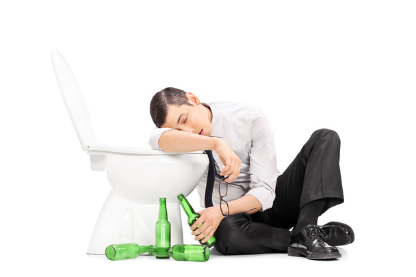 Male alcoholic sleeping on  toilet - Fotó, kép