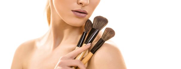 The cute woman with cosmetic brushes on the white background - Foto, Imagem