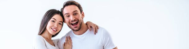 The happy man and a woman standing on a white background - Photo, Image