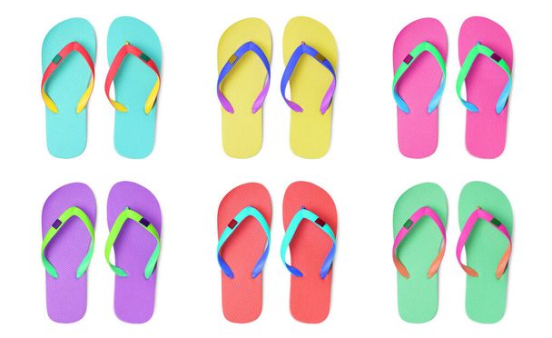 Set with different colorful flip flops on white background, top view - Foto, imagen
