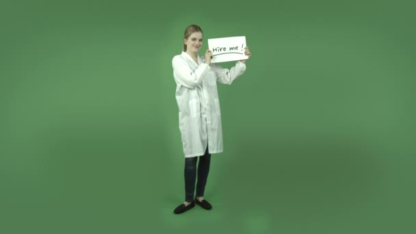 Girl in lab coat with hire me sign - Footage, Video