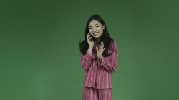 Asian woman in pajamas - Materiał filmowy, wideo