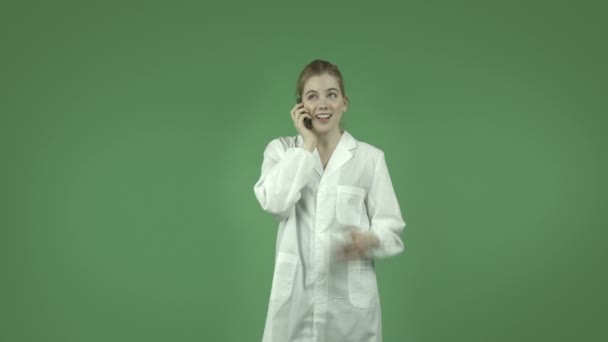 Girl in lab coat with cell phone - Footage, Video