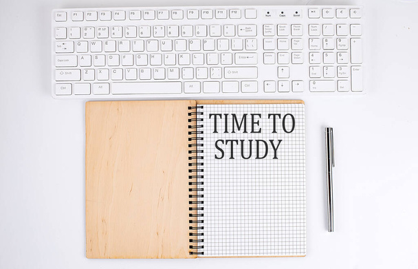 TIME TO STUDY text on the notebook with keyboard on white background - Foto, Imagen