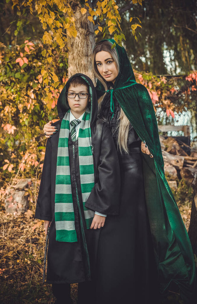 Halloween party ideas, people outfit. Woman and boy from school of wizards and magic - Foto, Bild