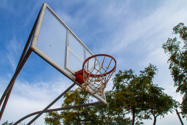 Vintage basket goal under the blue sky in a public park - Fotó, kép
