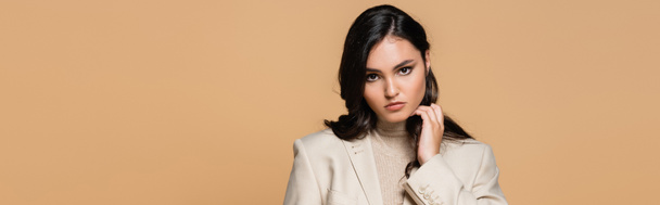 pretty young model in turtleneck and blazer isolated on beige, banner - Фото, изображение