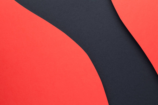 Red geometric shaded paper layers on black paper background. Copy space. Top view. Flat lay - Valokuva, kuva