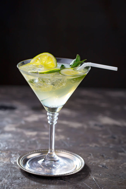Refreshing summer alcoholic cocktail with crushed ice and citrus fruits - Photo, Image