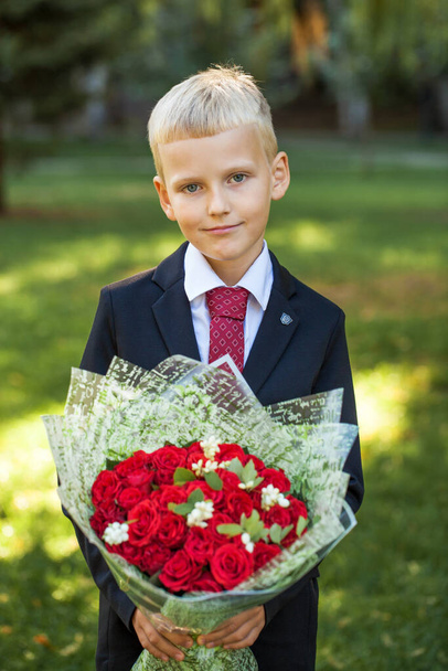 First grader, portrait of a young handsome boy in school uniform - Foto, Bild