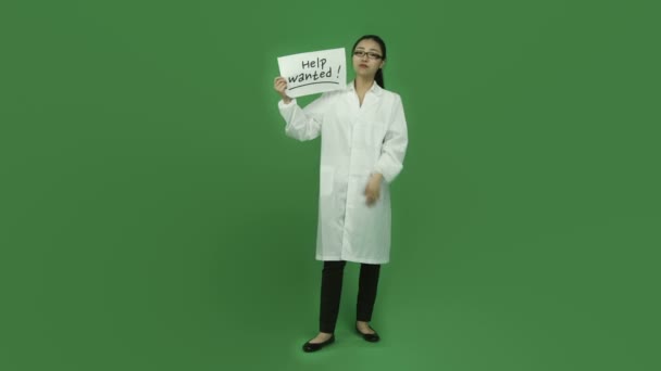 Scientist worried and holding help wanted sign - Footage, Video