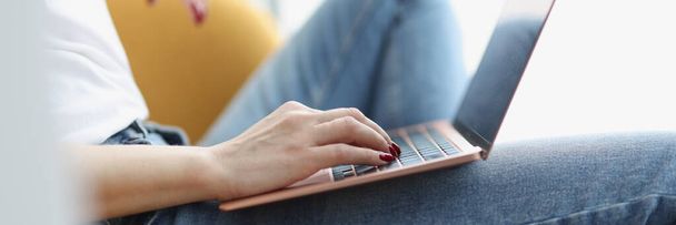 Female hands on keyboard on laptop closeup - Foto, afbeelding