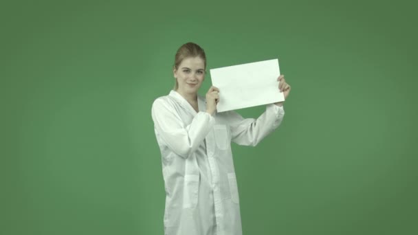 Happy girl in lab coat with blank sign - Footage, Video