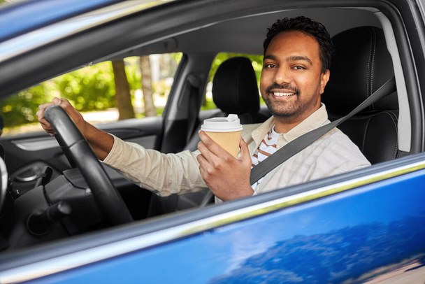happy indian man or driver with coffee driving car - Φωτογραφία, εικόνα