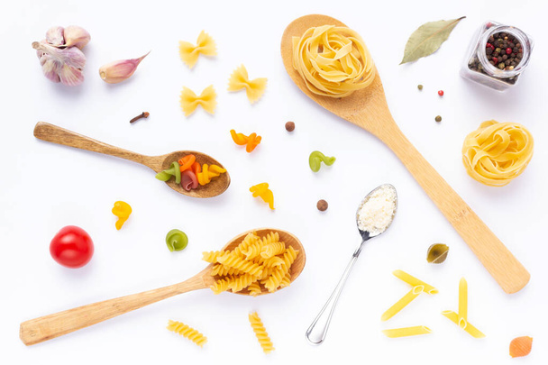 Pasta collection food on white background. Raw pasta assortment and spoon at white - Zdjęcie, obraz