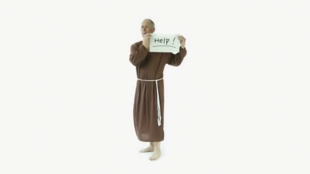 μοναχός κρατάει πινακίδα βοήθεια - Πλάνα, βίντεο