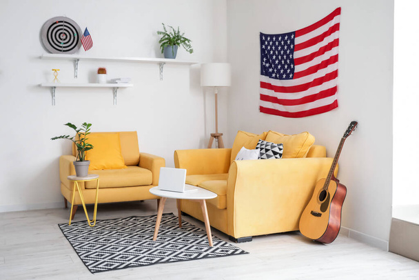 Interior of stylish living room with USA flag - Foto, afbeelding