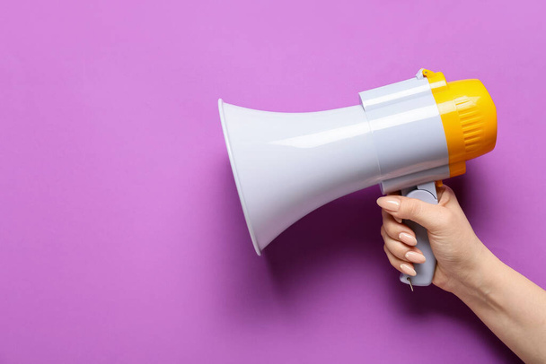 Woman with megaphone on color background - Photo, Image