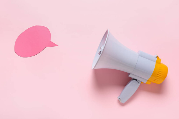 Modern megaphone and speech bubble on color background - Photo, Image