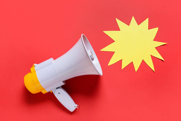 Modern megaphone and speech bubble on color background - Photo, Image