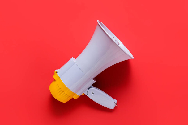 Modern megaphone on color background - Valokuva, kuva