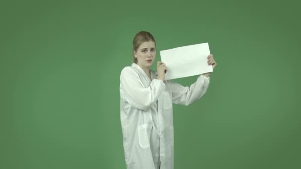 Girl in lab coat worried with blank - Footage, Video
