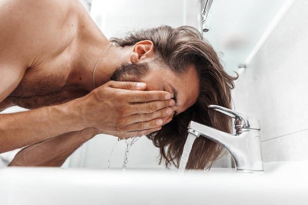Man washing his face, close-up photo - Valokuva, kuva