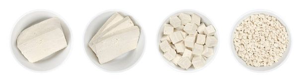 Processed white tofu, in white bowls. Single block, three slices,  cubes, and crumbled tofu. Bean curd, made of coagulated soy milk, a component of Asian cuisine and a meat substitute. Close-up. Photo - Photo, Image