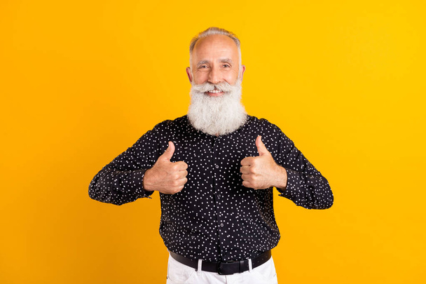 Photo portrait bearded man wearing shirt smiling showing thumb-up sign like isolated bright yellow color background - Foto, immagini