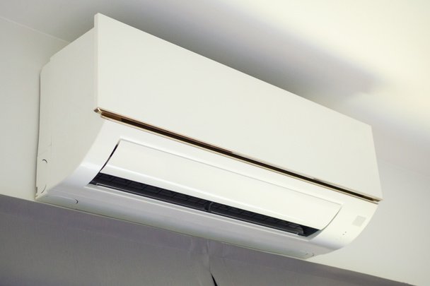 Air conditioner on white wall room interior background - Фото, зображення