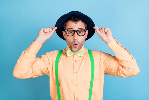 Photo of funky guy wow sale open mouth wear hat specs green suspenders shirt bow tie isolated blue color background - Photo, image