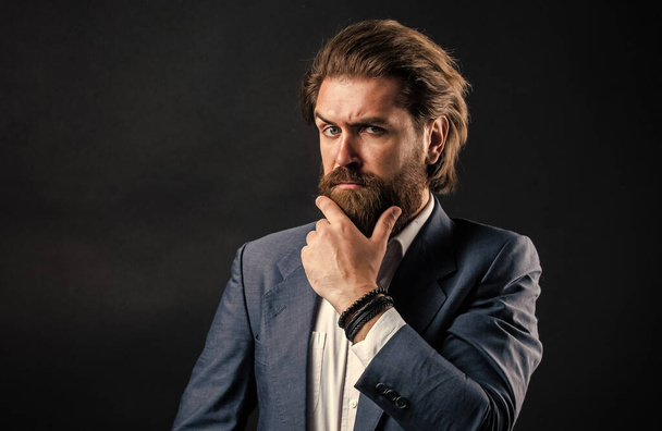 handsome and successful man in expensive suit. He in shirt with hand watch. stylish successful man in suit posing. business man wear suit. official office lifestyle. serious bearded man - Foto, immagini