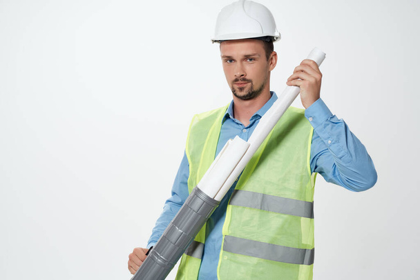 worker drawings in hand construction industry light background - Zdjęcie, obraz